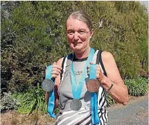  ??  ?? Kerikeri’s Margaret Crooke with her two silvers and a bronze medal in athletics events.