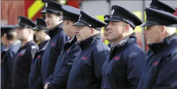  ??  ?? Members of the fire service in Bray at the commemorat­ion at the fire station.