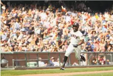  ?? Ezra Shaw / Getty Images ?? Denard Span sprints around third on his way home on Jarrett Parker’s check-swing, two-run double in the seventh inning. The hit broke a 1-1 tie and sparked the Giants to a win.