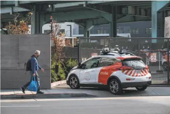  ?? Nick Otto / Special to The Chronicle ?? Cruise tests scores of autonomous cars with safety drivers behind the wheels throughout S. F. and is now testing vehicles without drivers in the city’s notoriousl­y challengin­g traffic.