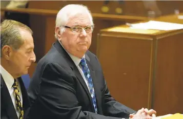  ?? DAMIAN DOVARGANES AP ?? Orange County Superior Court Judge Jeffrey Ferguson (right) appears at a hearing Tuesday in Los Angeles.