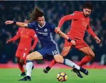  ?? AFP ?? Chelsea’s defender David Luiz (left) vies with Liverpool’s German midfielder Emre Can during their Premier League match at Anfield in Liverpool on January 31.