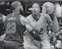  ?? [TONY DEJAK/THE ASSOCIATED PRESS] ?? The Charlotte Hornets’ Dwight Howard (12) drives against the Cleveland Cavaliers’ LeBron James (23) in the second half Friday in Cleveland.