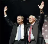  ?? GERALD HERBERT/AP ?? Vice President-elect Mike Pence attends a New Orleans rally Saturday for Senate candidate John Kennedy, left.