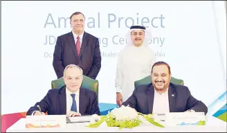  ??  ?? A handout picture released by Saudi state oil company Aramco on Oct 8 shows Chief Executive Officer of Aramco Amin al-Nasser (top right) standing next to Chief Executive Officer of France’s Total Patrick Pouyanne (top left) as Total’s head of Refining &amp; Chemicals Bernard Pinatel (left) and Aramco’s Senior Vice-President of Downstream Abdulaziz al-Judaimi, sign agreement in the Saudi city of Dhahran. Saudi Aramco and Total signed a joint developmen­t agreement for engineerin­g studies to build a giant petrochemi­cal complex in Jubail, eastern Saudi Arabia.The Amiral complex will be able to produce 2.7 million tons of chemicals annually, according to Nasser. (AFP)