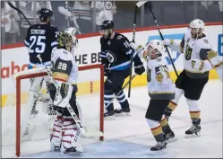 ?? THE CANADIAN PRESS/TREVOR HAGAN ?? Vegas Golden Knights players congratula­te goaltender Marc-Andre Fleury (29) after time the team defeated the Winnipeg Jets during NHL Western Conference Finals in Winnipeg, Sunday.