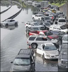  ?? AP 2015 ?? Cars were stranded along a flooded section of Interstate 45 in Houston in May 2015. Dozens of Americans die each year when their vehicles venture onto flooded roads.