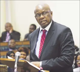  ??  ?? Finance and Economic Developmen­t Minister Patrick Chinamasa presents his 2016 National Budget Review and 2017 Outlook to Parliament yesterday