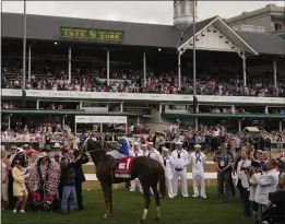  ?? JEFF ROBERSON – THE ASSOCIATED PRESS ?? Luis Saez sits atop Secret Oath in the winner's circle following the filly's victory in the Kentucky Oaks on May 6. Secret Oath is among the nine entries for Saturday's Preakness.