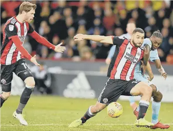  ??  ?? Sunderland sub Joel Asoro battles in vain against Sheffield United striker Leon Clarke.