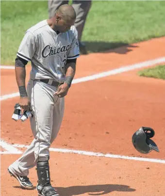  ?? | GETTY IMAGES ?? Alejandro De Aza, who hit his 13th home run Thursday, whips his helmet off after striking out in the third inning.