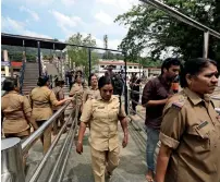  ?? AP ?? Policewoma­n, above the age of 50, who have been deployed for security return after worshippin­g at the Sabarimala temple on Monday. —