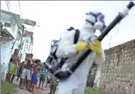  ?? UESLEI MARCELINO / REUTERS ?? A municipal worker sprays insecticid­e in Recife, Brazil, on Tuesday as part of the city’s efforts to prevent the spread of the Zika virus.