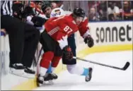  ?? NATHAN DENETTE — THE ASSOCIATED PRESS ?? Canada’s Sidney Crosby gets entangled with Europe’s Leon Draisaitl (29) along the boards during the second period of Game 1 of the World Cup of Hockey finals Tuesday.