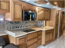  ?? ?? The galley of a Ventana model coach made by Newmar, whose parent company is Winnebago.