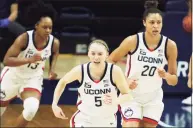  ?? David Butler II / USA TODAY ?? UConn’s Christyn Williams (13) Paige Bueckers (5) and Olivia Nelson-Ododa (20) take the court for the start of the second quarter against Marquette on Monday night in Storrs.