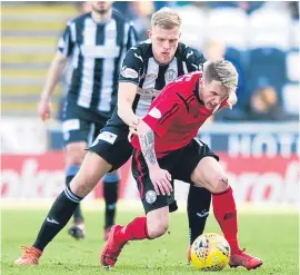  ?? Picture: SNS Group. ?? Brechin City’s Liam Watt shields the ball from St Mirren’s Adam Eckersley.