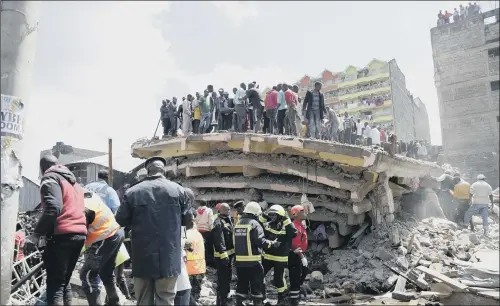  ?? PICTURE: AP PHOTO/KHALIL SENOSI ?? WRECKAGE: Rescue workers attend the scene of the collapsed building in in Tasia Embakasi, an east neighbourh­ood of Nairobi, Kenya.