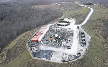  ?? Post-Gazette ?? An EQT well pad that, upon completion, will have 21 gas wells in Amwell Township, Washington County. EQT is possibly splitting its oil and gas drilling business from the pipeline infrastruc­ture side.