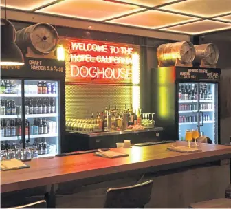  ?? TERRI COLBY / TNS ?? COME ON IN: DogHouse hotel’s lobby feels more like a bar than a lobby.