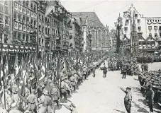  ?? /Getty Images/ Bettmann ?? Swagger parade:
Nazi soldiers on the march through the streets of Nuremberg during World War 2.