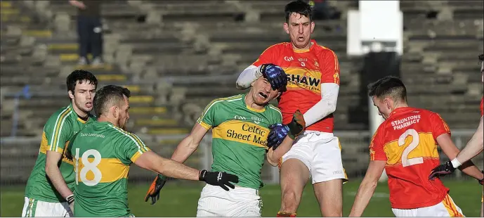  ??  ?? Tourlestra­ne’s Adrian McIntyre is stopped by Castlebar Mitchels in the Connacht Senior Club semi-final at MacHale Park on Sunday. Pics: Tom Callanan.