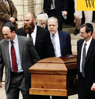  ?? MATT ROURKE / THE ASSOCIATED PRESS ?? A casket is carried out of Rodef Shalom Congregati­on on Tuesday after funeral services for brothers Cecil and David Rosenthal in Pittsburgh, Penn. The brothers were killed in the mass shooting Saturday at the Tree of Life synagogue.