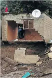  ?? Picture: Reuters ?? Salvaging materials from damaged houses after heavy rain caused flooding in Marianhill.