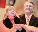  ?? AP FILES ?? Then-Ukrainian presidenti­al candidate Viktor Yushchenko, and his wife, Kateryna, appear at a 2004 rally in Kyiv as Yushchenko claimed victory.