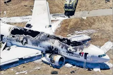  ?? Marcio Jose Sanchez Associated Press ?? AN AERIAL PHOTOGRAPH shows the wreckage of Asiana Airlines Flight 214 after it crash-landed at San Francisco Internatio­nal Airport. Officials said there was no indication that terrorism was involved.