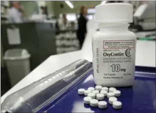  ?? TOBY TALBOT — THE ASSOCIATED PRESS ?? OxyContin pills are arranged for a photo at a pharmacy in Montpelier, Vt.
