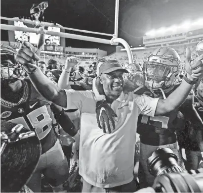  ?? MELINA MYERS/USA TODAY SPORTS ?? Willie Taggart celebrates beating North Carolina State on Sept. 28. The Seminoles have won three of four games.