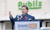  ?? BOB SELF/AP ?? Gov. Ron DeSantis announced the expansion of the use of Publix pharmacies as vaccinatio­n sites Jan. 13. All Palm Beach County stores will start offering shots.