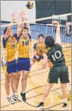  ?? JASON SIMMONDS/JOURNAL PIONEER ?? The Westisle Wolverines’ Carter Cahill, 9, and Lucas Gallant, 10, attempt to block a spike attempt by the Three Oaks Axemen’s Ben MacDougall on Wednesday night. Westisle’s Thomas Rennie, 6, and Isaac Oliver position themselves to play the ball. The Axemen won the P.E.I. School Athletic Associatio­n Senior AAA Boys Volleyball League semifinal match 3-1.