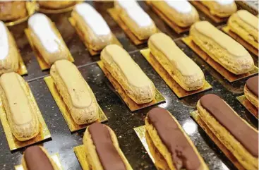  ?? Melissa Phillip photos /Houston Chronicle ?? A variety of eclairs awaits at Eclair Paris, 2278 W. Holcombe. The bakery-cafe serves pleasant breakfast, lunch and dinner options, plus desserts.