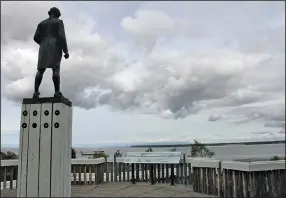  ?? (AP/Mark Thiessen) ?? The Captain James Cook statue faces the inlet that bears his name and fronts downtown in Anchorage, Alaska’s largest city. Alaska residents are looking to eliminate statues of colonialis­ts accused of abusing and exploiting indigenous people.