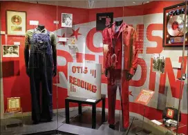  ?? MELISSA RUGGIERI / FOR THE AJC ?? The Grammy Museum in Los Angeles is home to some of Grammy Award winner and Georgia native Otis Redding’s original stage outfits, including the overalls from a music video and his famous red suit from his 1967 tour of Europe.