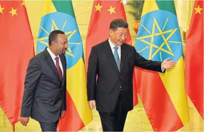  ?? /Getty Images/Kyodo ?? New times: Ethiopia’s Prime Minister Abiy Ahmed, left, is shown the way by Chinese president Xi Jinping at the Great Hall of the People in Beijing, China, in April 24 2019.