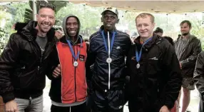  ?? ?? MEDAL WINNERS: Brent Lindeque congratula­tes top three in the 18km event, from left, Butshabeth­u Kayi, Mzwanele Maphekula and Ross Chapman.
