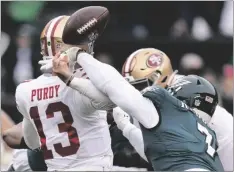  ?? AP PHOTO/SETH WENIG ?? Philadelph­ia Eagles linebacker Haason Reddick (right) causes a fumble by San Francisco 49ers quarterbac­k Brock Purdy during the first half of the NFC Championsh­ip NFL football game between the Philadelph­ia Eagles and the San Francisco 49ers on on Sunday in Philadelph­ia.