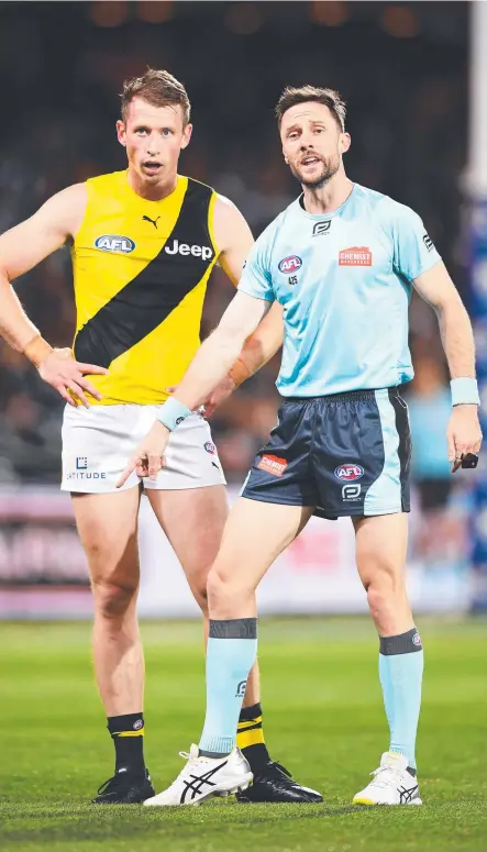  ?? . Picture: Mark Brake/Getty Images ?? Brett Rosebury points to mark for Richmond’s Dylan Grimes against Port Adelaide