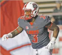 ?? ANDRES LEIGHTON/THE ASSOCIATED PRESS ?? UNM running back Richard McQuarley celebrates after scoring one of his five touchdowns Saturday against Air Force in Albuquerqu­e.