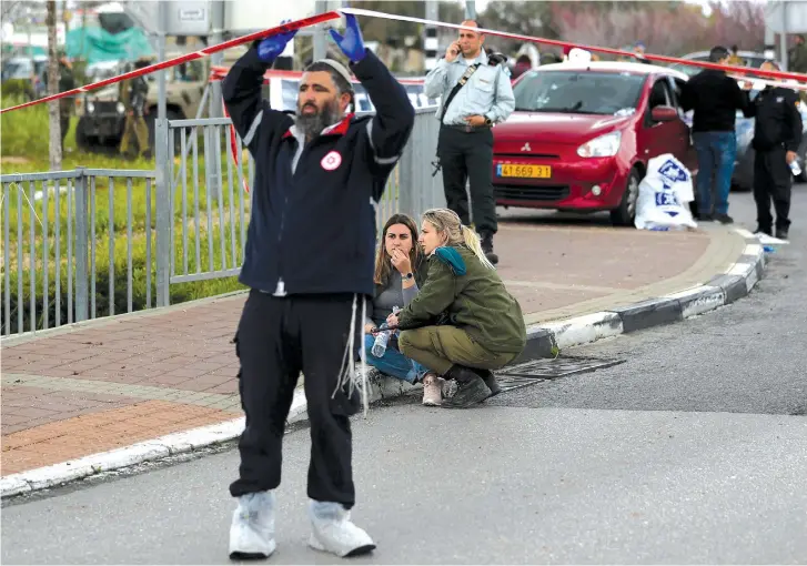  ?? (Reuters) ?? THE AFTERMATH of a terror attack near Ariel earlier this year.