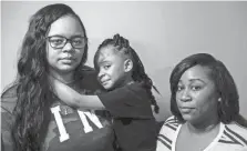  ??  ?? Hailey Turner, 5, with her mother, Ciara Morgan, left, and aunt, Latasia Turner on Monday. Hailey says that her teacher hit her in the face with a ruler. BRAD VEST/THE COMMERCIAL APPEAL