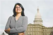  ??  ?? Rashida Tlaib, posing near the Michigan Capitol in Lansing, is expected to become the first Muslim woman and Palestinia­n-American to serve in the U.S. Congress.