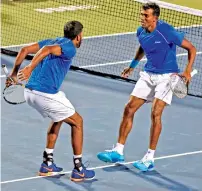  ?? PTI ?? India’s Bopanna (left), celebrates with his partner Balaji after their win over Uzbekistan’s Farrukh Dustov and Sanjar Fayziev. —