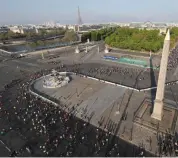  ?? AFP ?? In this file photo, runners go past the Concorde monument during the Paris Marathon. —