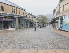  ??  ?? QUIET STREETS: Our towns and villages have been very quiet over the past 12 months. With three lockdowns and months of restrictio­ns, businesses in Calderdale have been hit hard by the pandemic. This picture shows an empty Woolshops in Halifax during the second lockdown in November. Businesses will now be looking towards April 12 and May 17, both key dates in the Government’s roadmap allowing the gradual opening of non-essential shops, hospitalit­y and more.