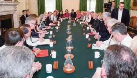  ??  ?? LONDON: Britain’s Prime Minister Theresa May (center left) holds the first Cabinet meeting of her new team at 10 Downing Street yesterday. —AFP