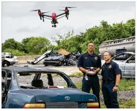  ?? JAY JANNER / AMERICANST­ATESMAN ?? Austin Fire Department Capt. Greg Pope (left) and firefighte­r Coitt Kessler demonstrat­e flying a DJI Inspire 1 drone at the department’s training academy on April 20. The Fire Department recognized the value of drones while responding to wildfires in Bastrop.
